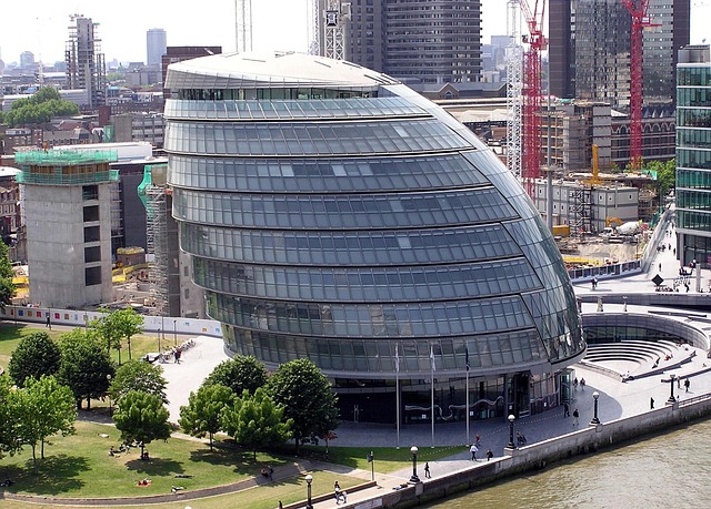 London office building exterior with midnight navy and electric blue lighting accents